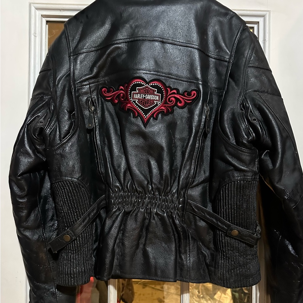 Woman’s large black leather original Harley Davidson jacket